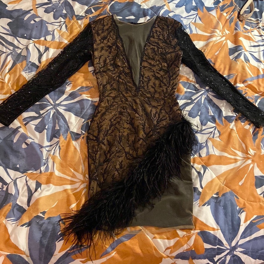 Beautiful black dress with Glitter popping out and fur towards the bottom.